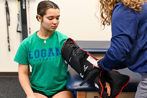 An instructor demonstrating the use of a medical device