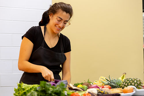 A woman cutting vegetables
